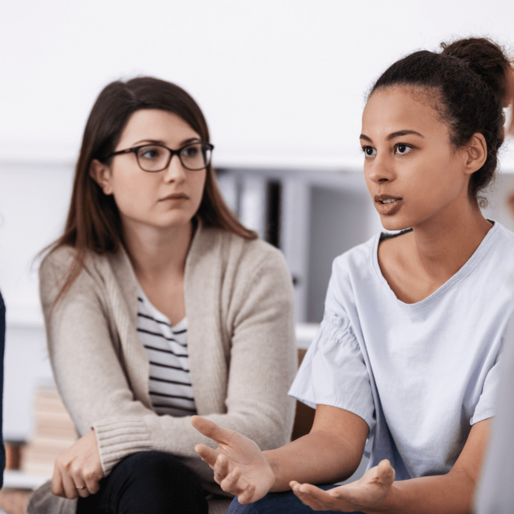 two women talking during a support group