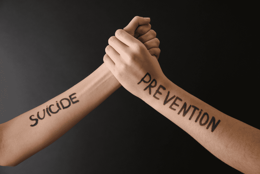 Arms saying "suicide prevention"